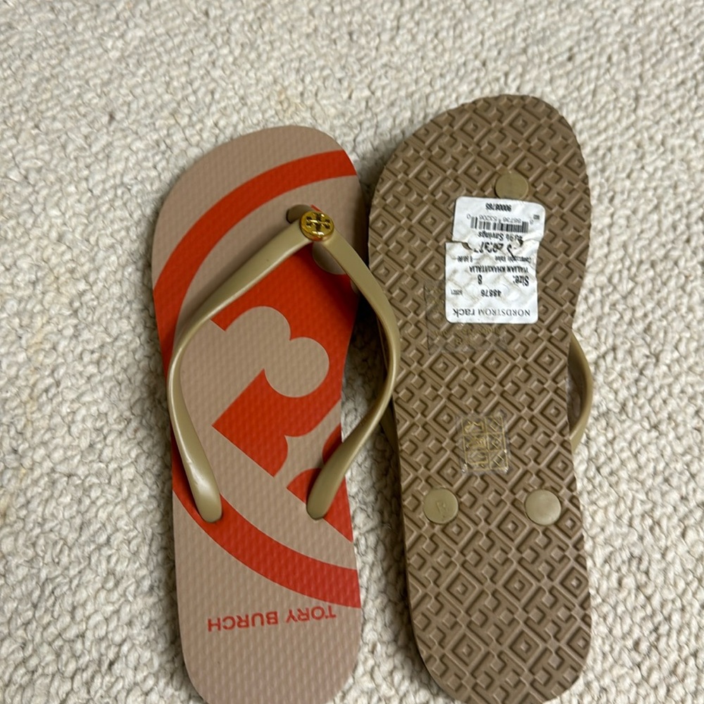 New Tory Burch flip flops.  Never worn size 8